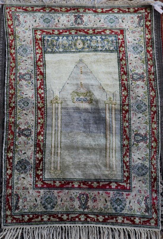 A Panderma part silk pale green/grey ground prayer rug, 5ft 4in by 3ft 6in.